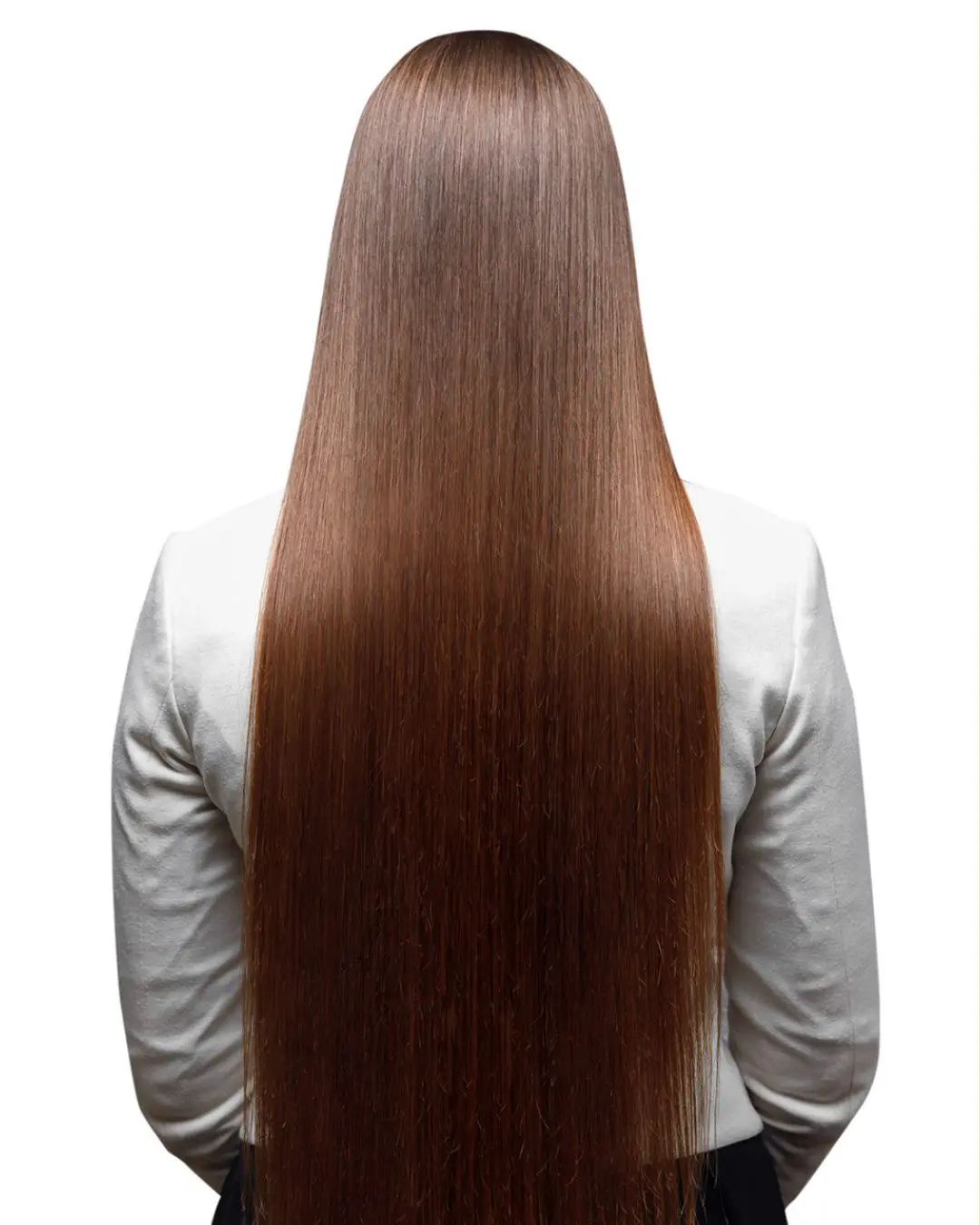 Everything You Need To Know About Keratin Treatments Portfolio 2 After 1080 x 1350 A person with long, straight brown hair is seen from the back, wearing a white top. The hair extends almost to the waist, suggesting a visit to the best hair salon Cary NC has to offer; the background is a plain white.