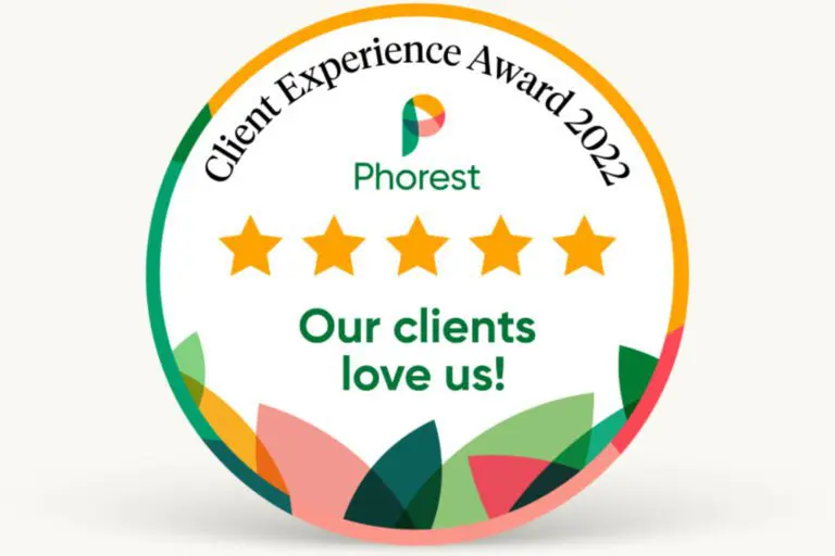 An award badge with a multicolored border displaying the text "Client Experience Award 2022" at the top, "Phorest" in the center with a five-star rating beneath it, and "Our clients love us!" at the bottom—a testament for any hair salon near me striving to achieve excellence.