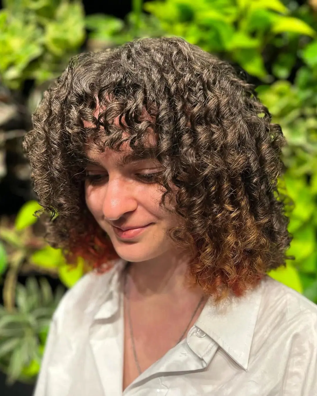 Curly Bangs for Round or Oval Faces with Tight Curls or Coily Hair Curly Bangs for Round or Oval Faces with Tight Curls or Coily Hair