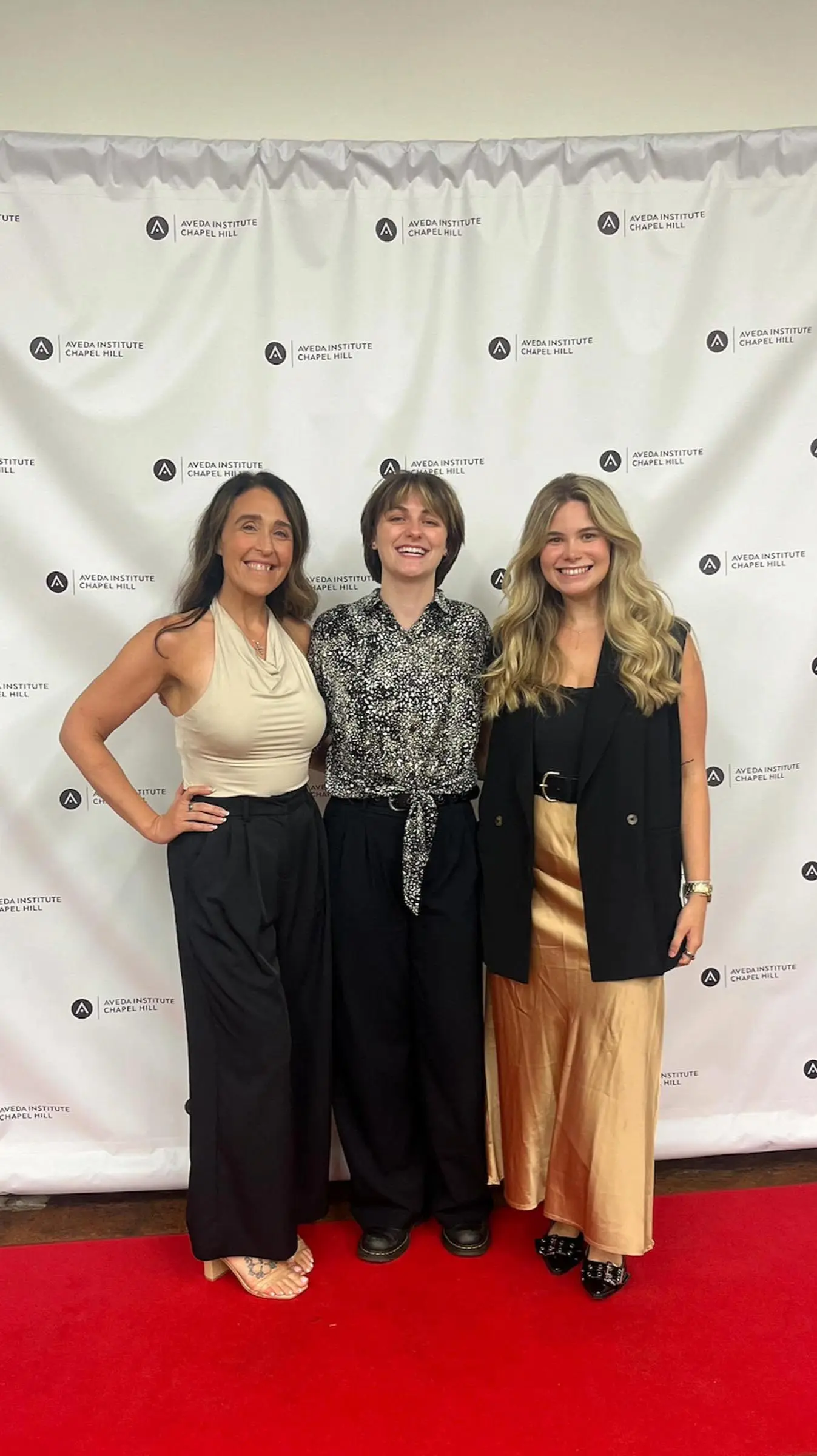 Lizzie, Jess, and Marketing Manager Maddy Schreiber at Aveda Institute Chapel Hill ahead of the Kacey Welch Method™ extension demo. Lizzie, Jess, and Marketing Manager Maddy Schreiber at Aveda Institute Chapel Hill ahead of the Kacey Welch Method™ extension demo.