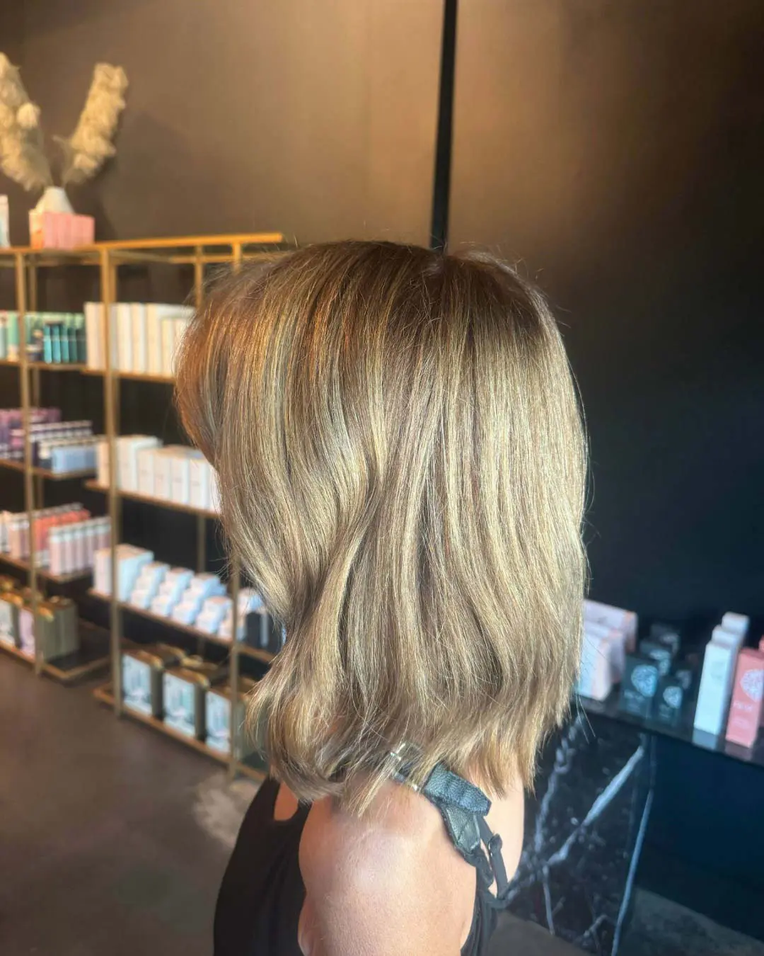Lived-In Honey Blonde Lob with Soft Waves Get a chic hair transformation with honey blonde highlights and a textured lob. Our expert stylists await! Book your appointment at Sunday Salon today!