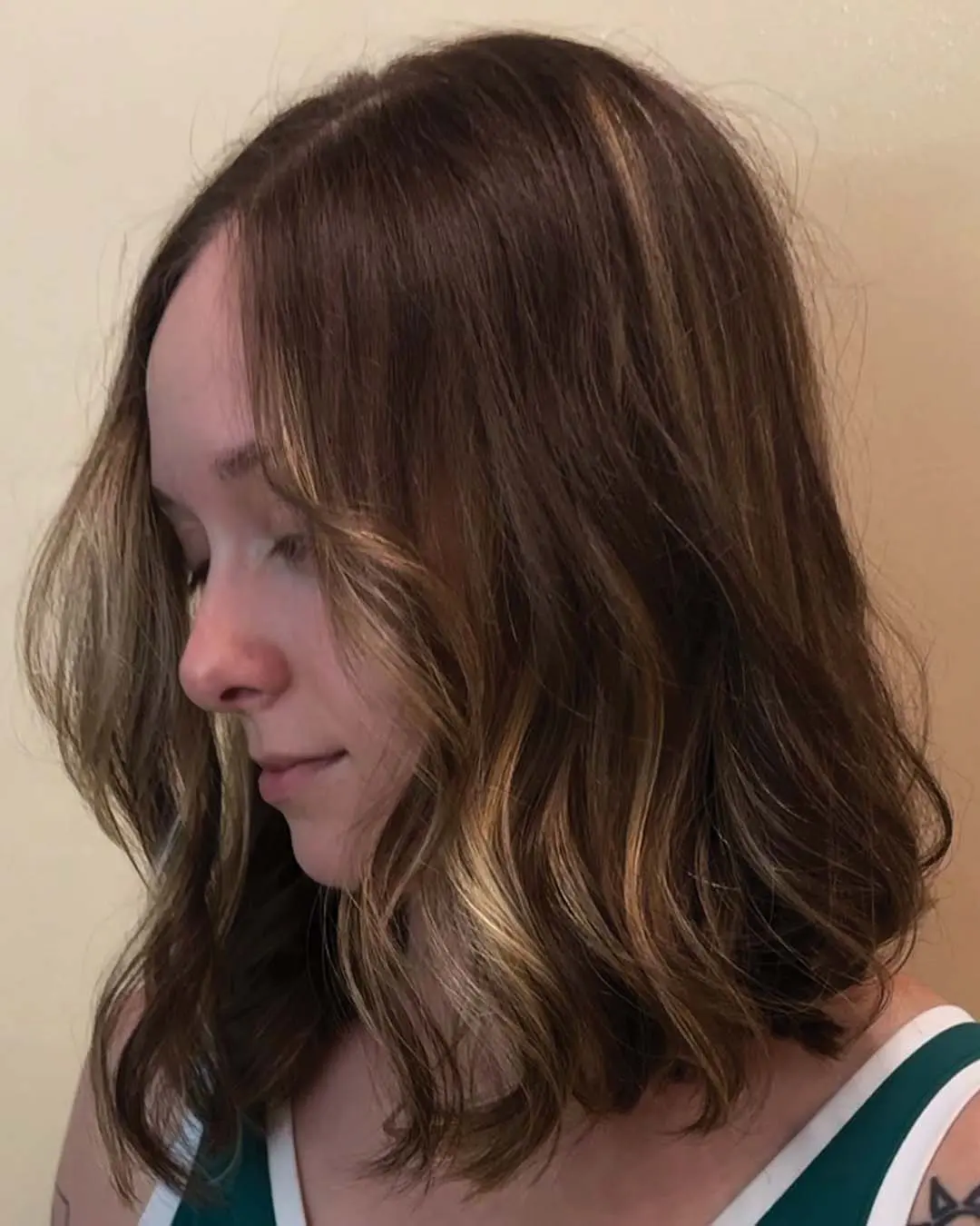 Dimensional Warm Honey Lob with Soft Effortless Waves A shoulder-length lob with rich brunette base tones, soft warm honey money piece framing, and lived-in waves created at Sunday Salon in Raleigh.